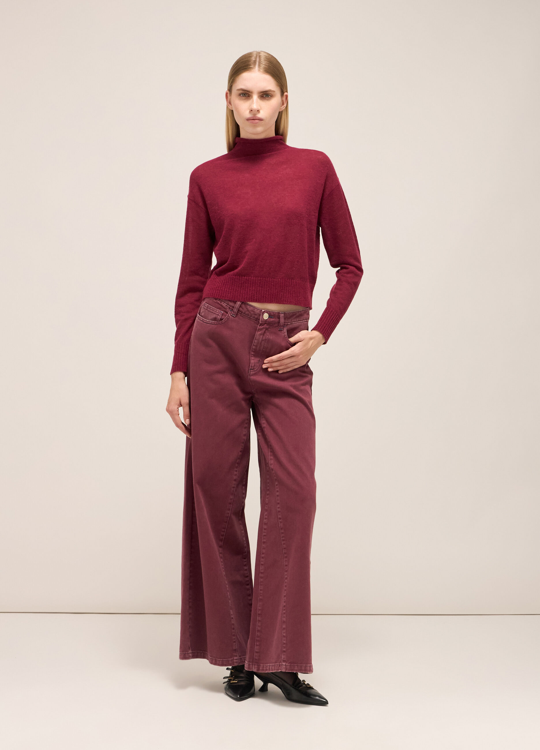 Knitted sweater with high neck