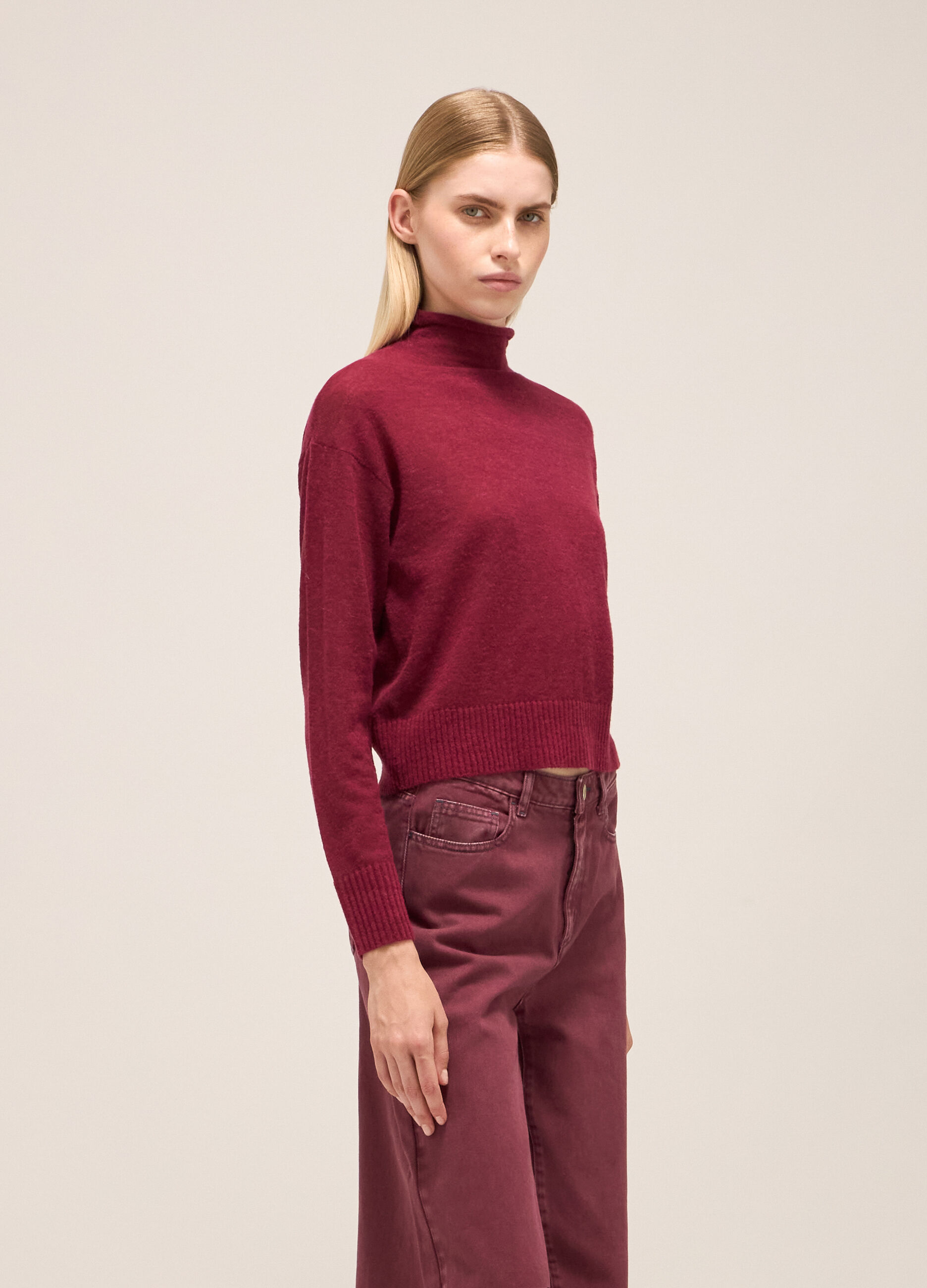 Knitted sweater with high neck