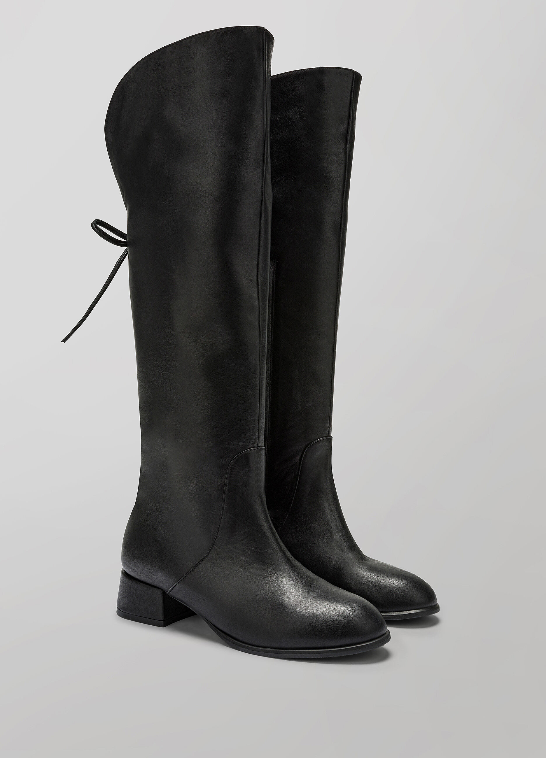 Black faux leather knee-high boot