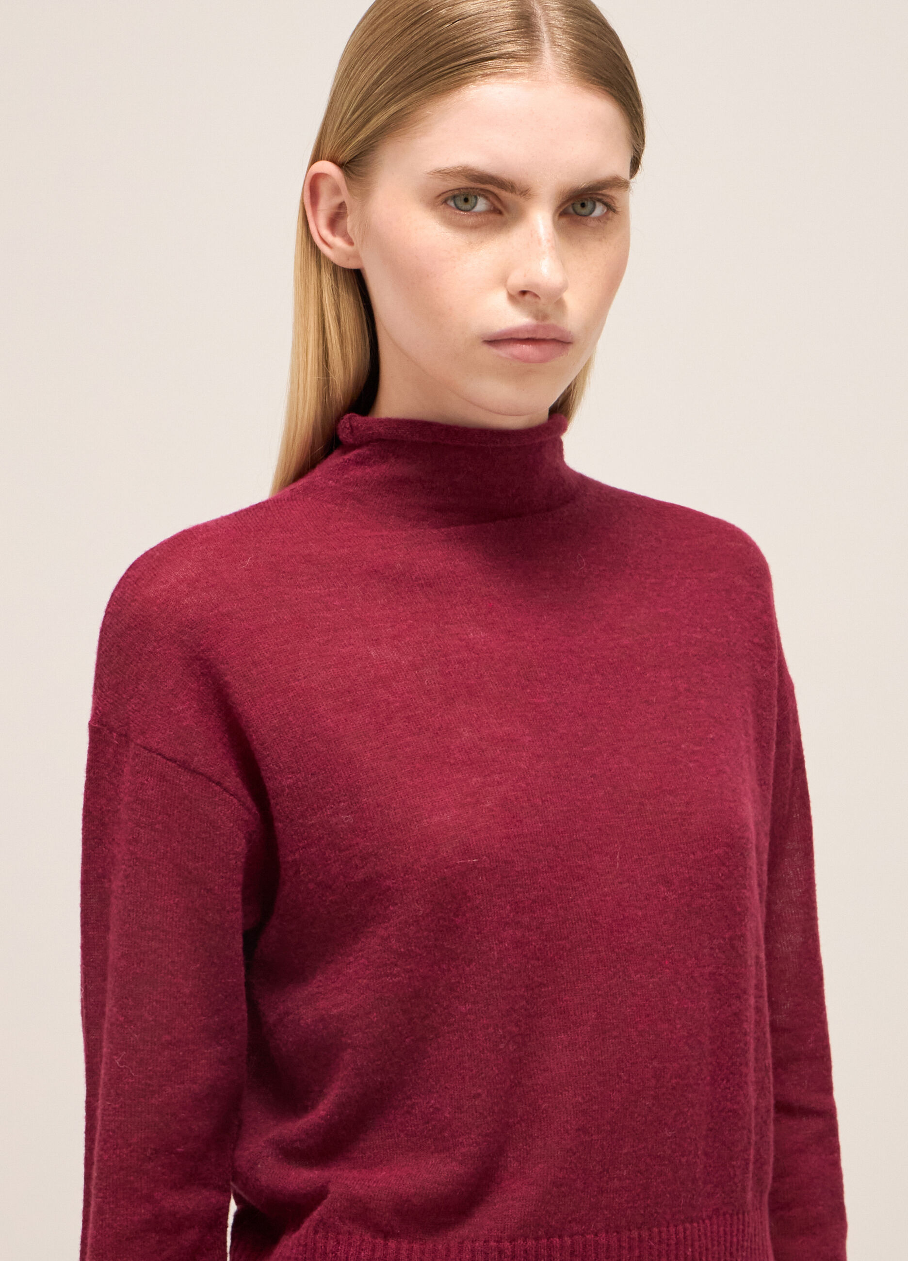 Knitted sweater with high neck