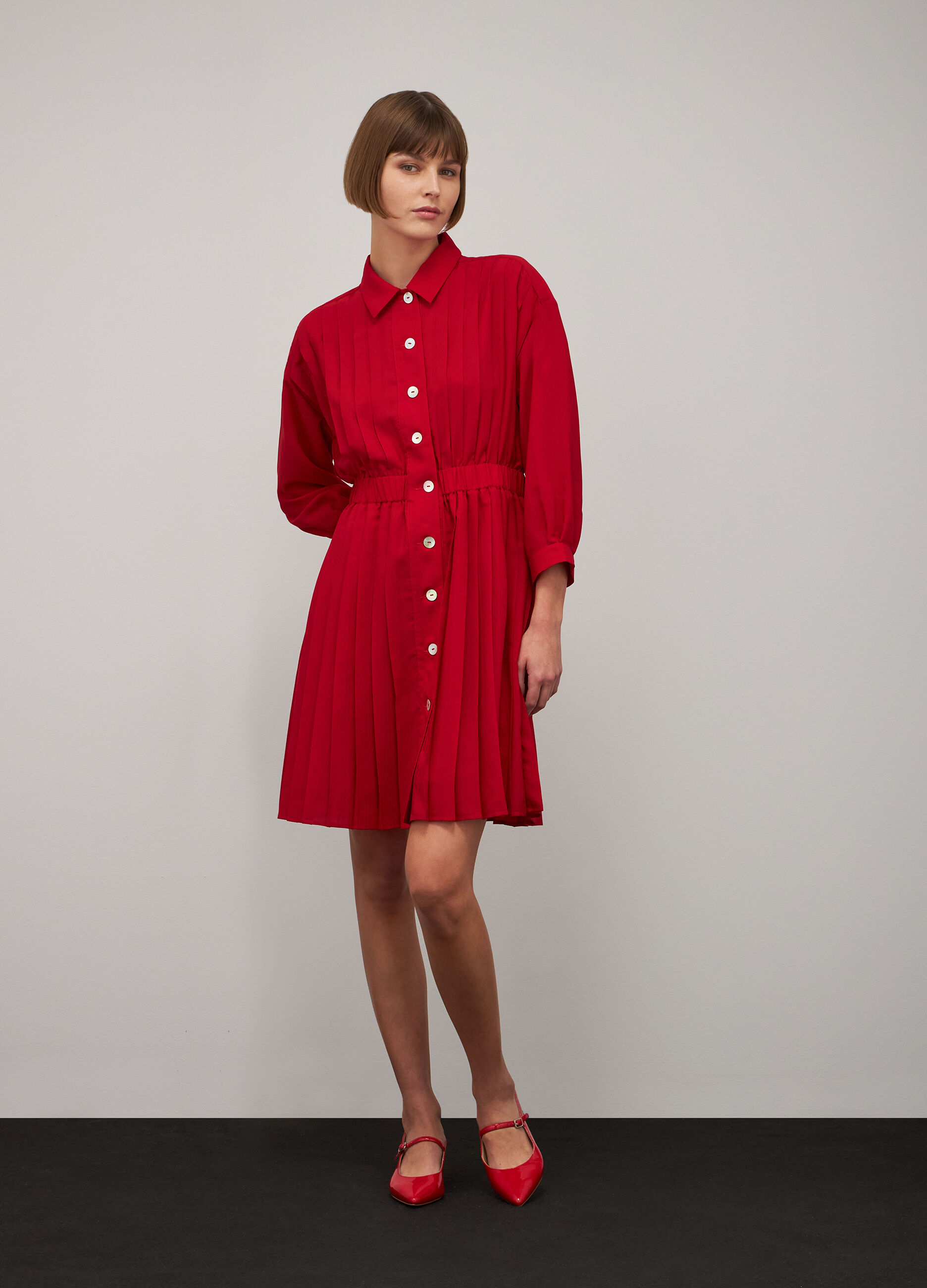 Red pleated dress