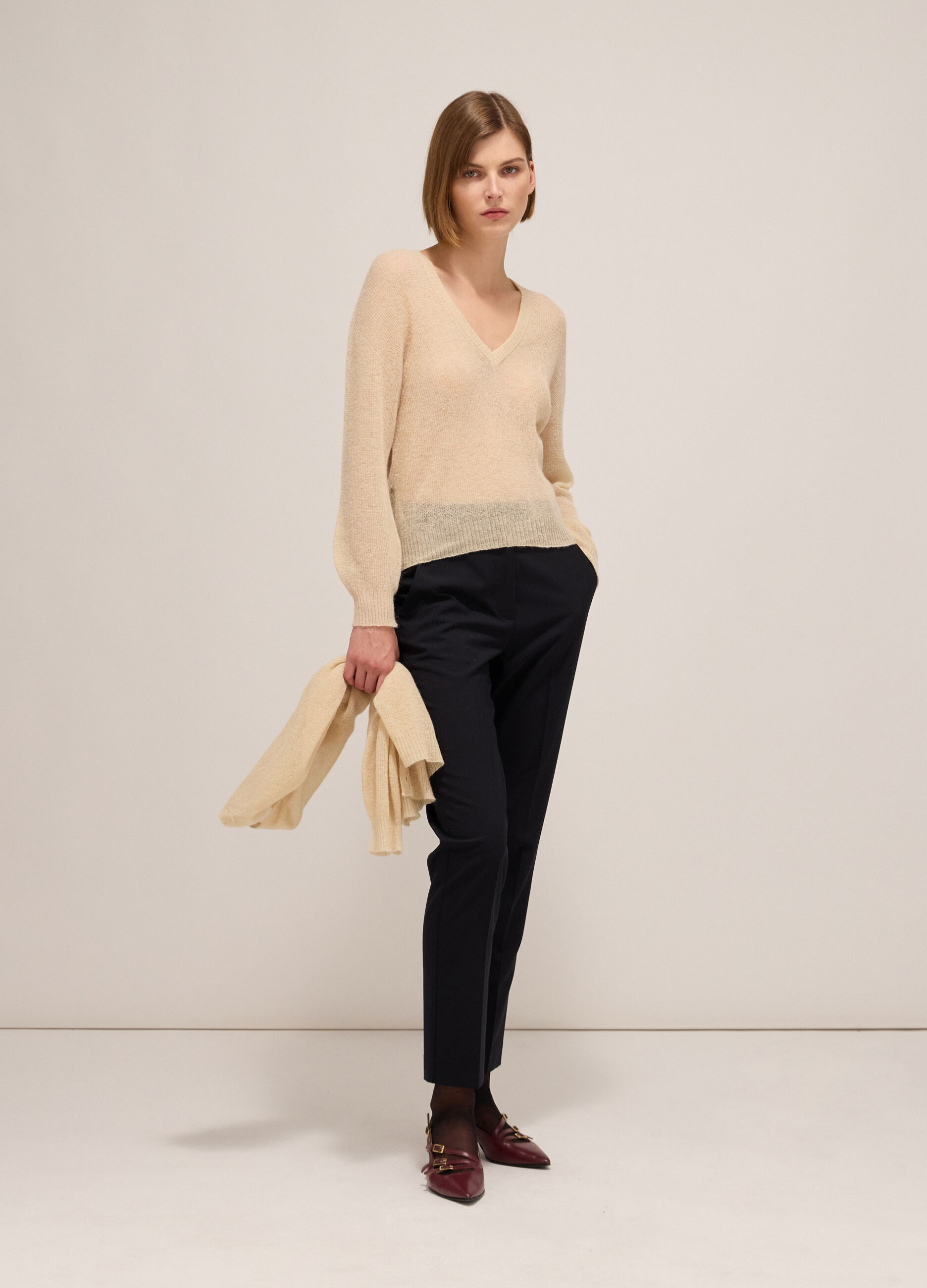 Knitted sweater with V neck