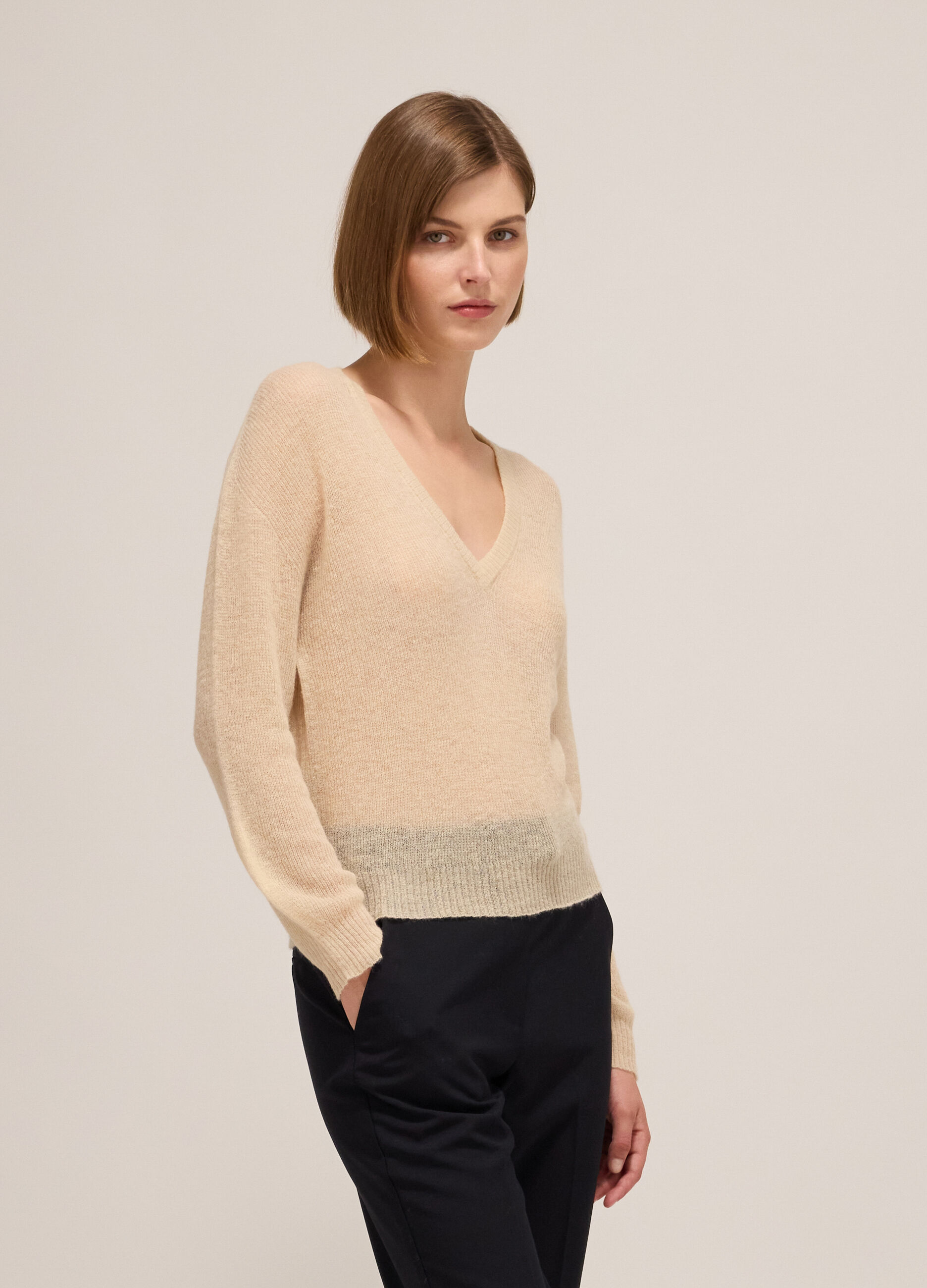 Knitted sweater with V neck