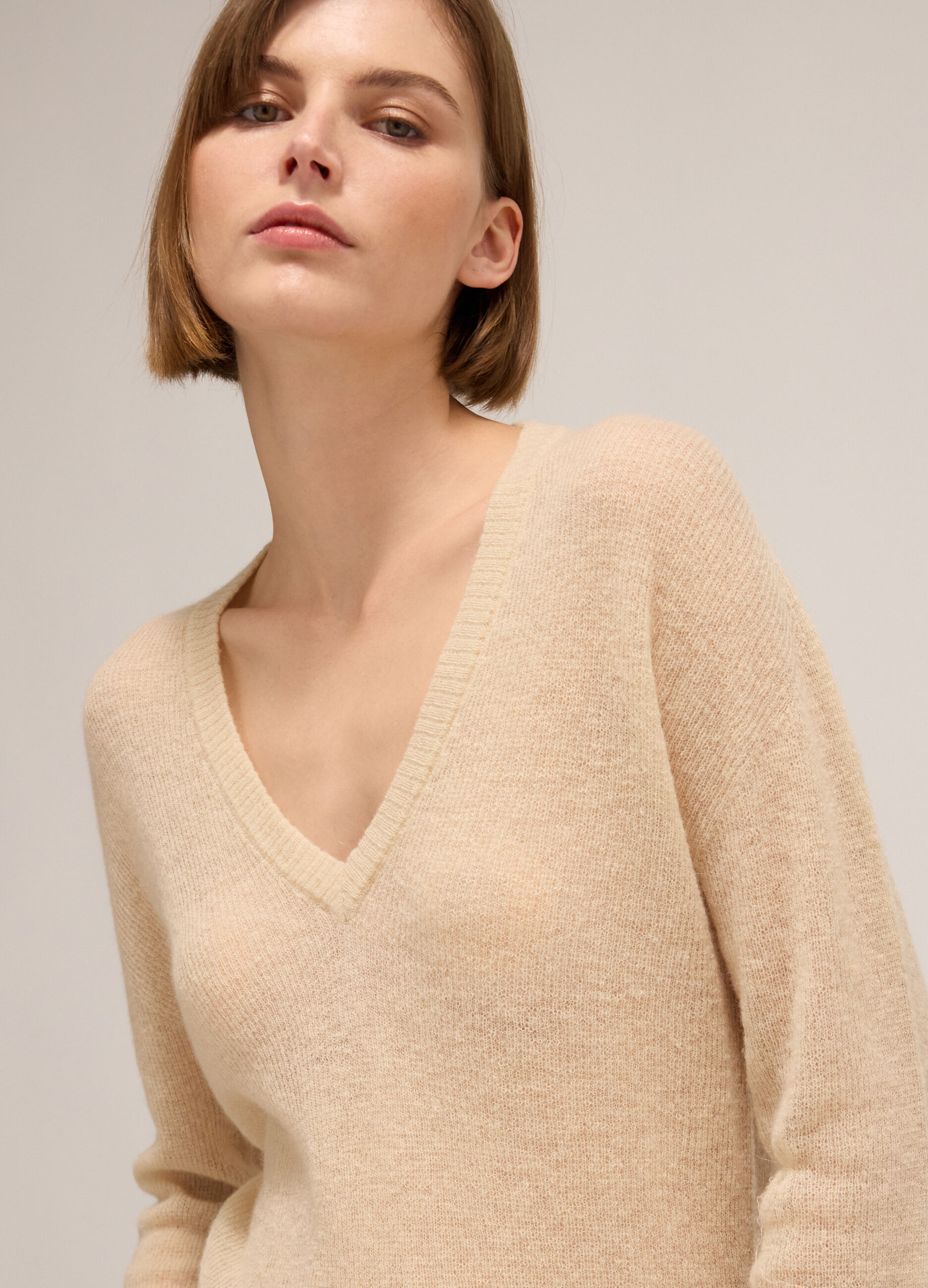 Knitted sweater with V neck