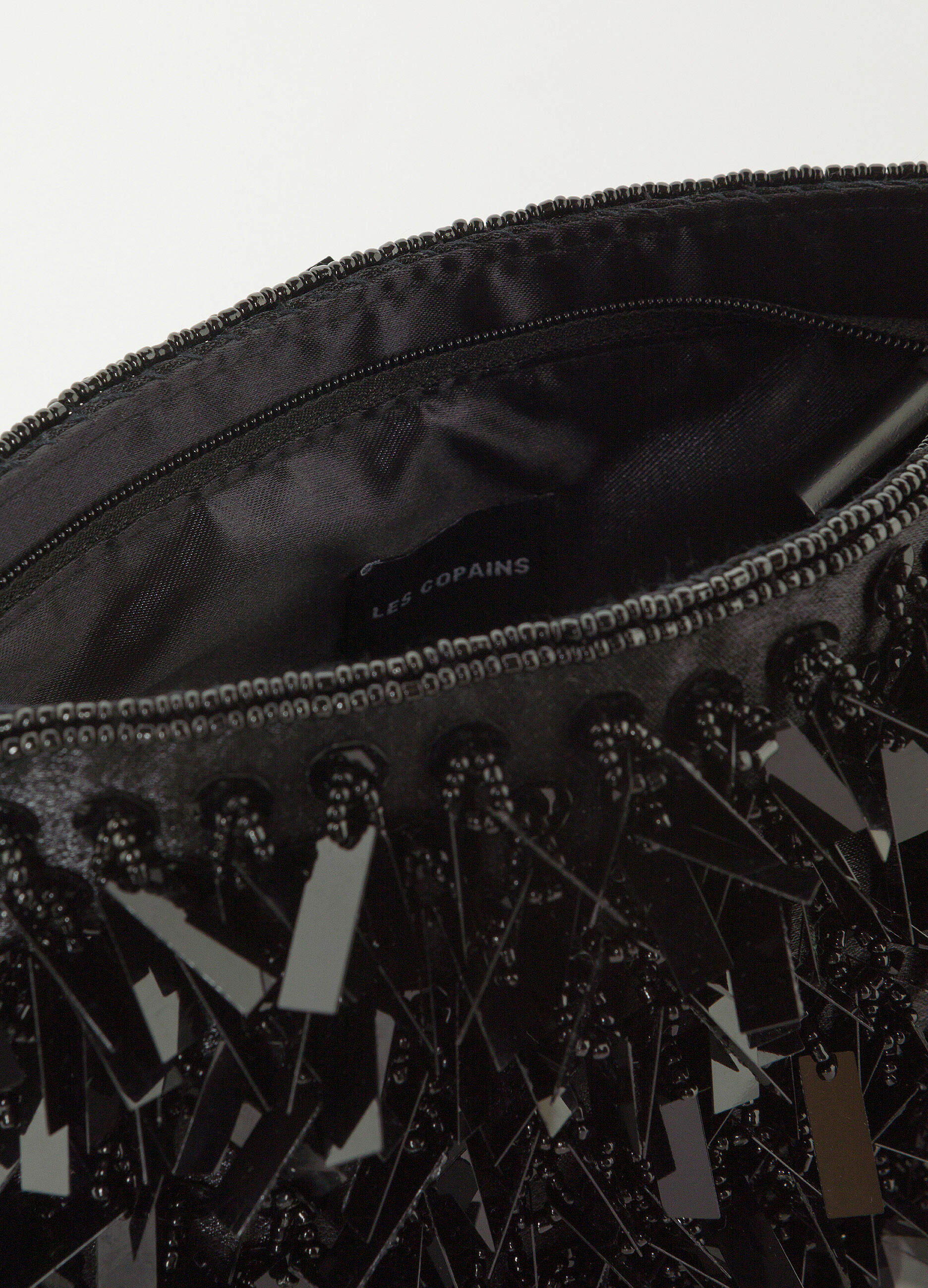 Black shoulder bag with appliqués